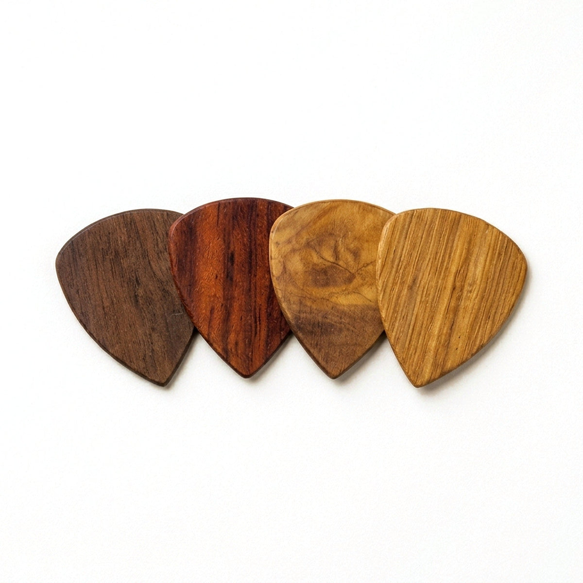 Personalised wooden plectrums in Walnut, Rosewood, Olive and White Oak