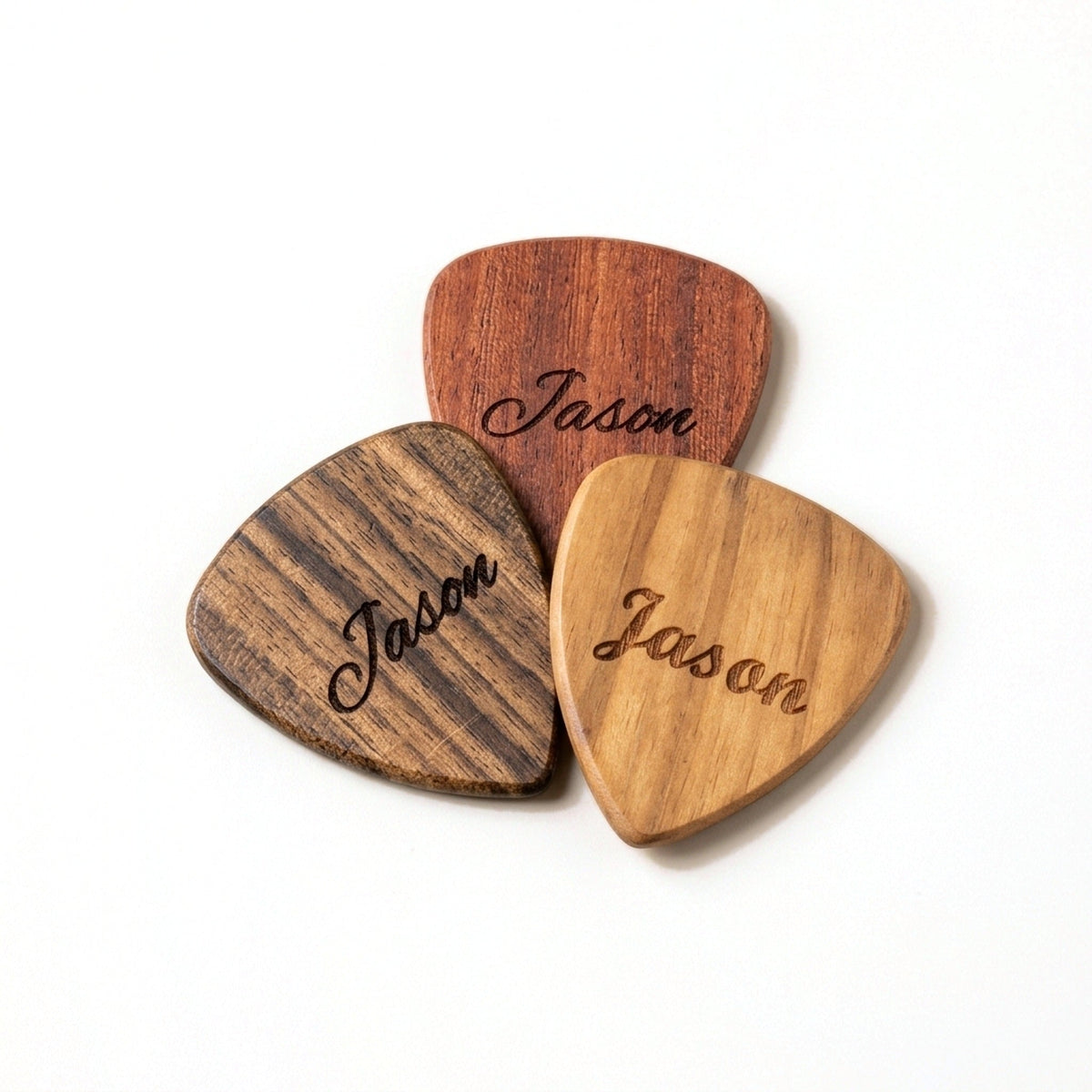 Three wooden guitar picks engraved with a name, from £6.95 each