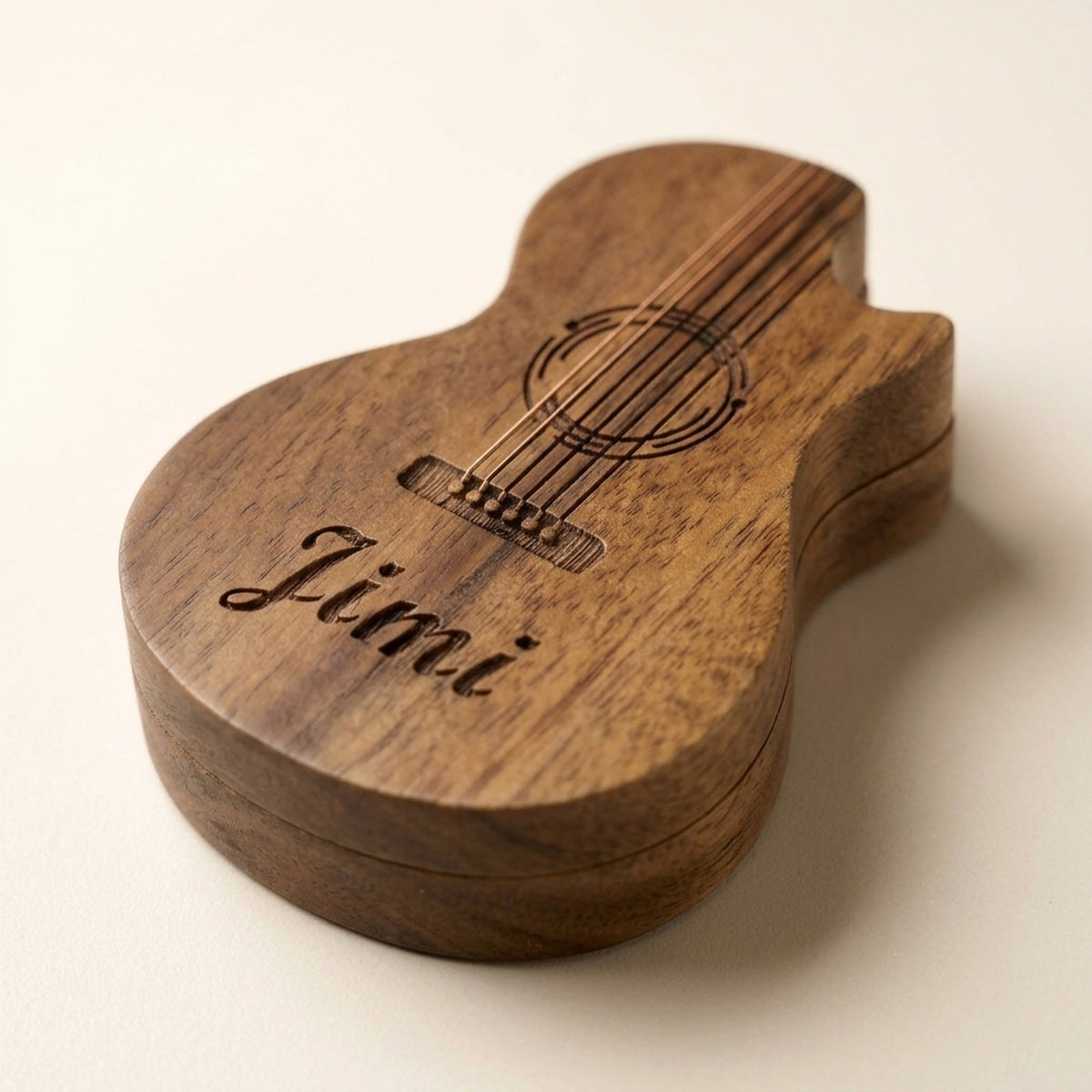 Personalised guitar-shaped wooden pick box engraved with a guitar and the name Jimi