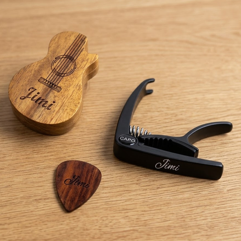 Personalised guitar gift set: engraved guitar-shaped pick box, wooden pick and black capo, all engraved Jimi