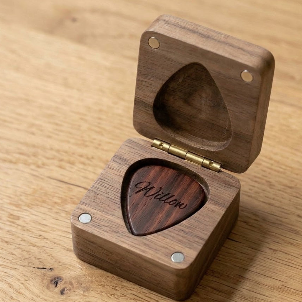 Square hinged walnut pick box open with an engraved rosewood pick